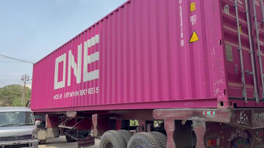 Loaded export container on a trailer leaving the factory